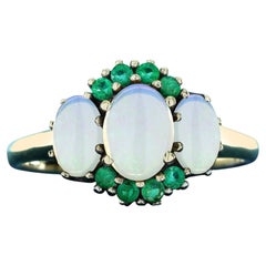 Three Oval Opal and Emerald Three Stone Ring in 9K Yellow Gold