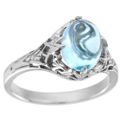 Cabochon Blue Topaz Filigree Engagement Ring in 9K White Gold