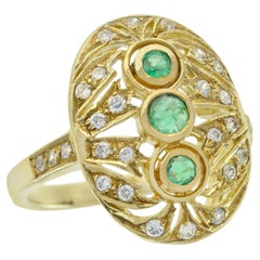 Emerald and Diamond Oval Openwork Three Stone Ring in 14K Gold