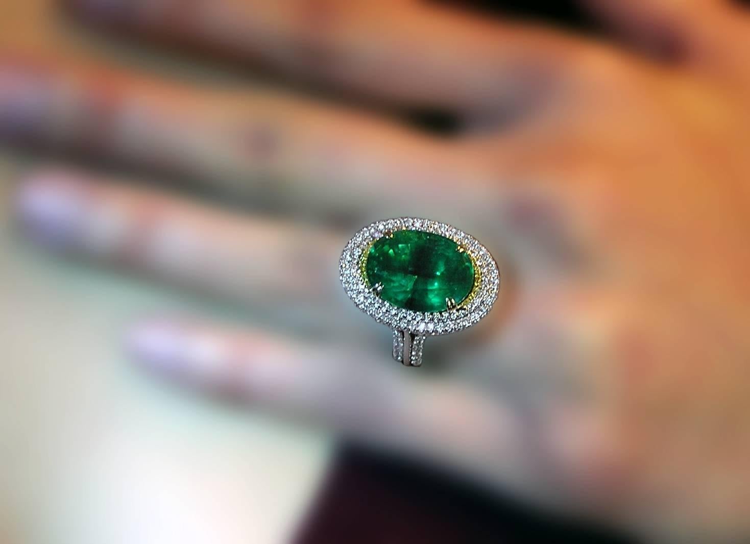 The Platinum and 18K yellow gold piece with a Zambian 11.36 carat oval cut emerald of superb quality.  GIA Certified.  Oval cut emeralds of this quality are difficult to find today.  The ring with almost two carats of white and natural Canary