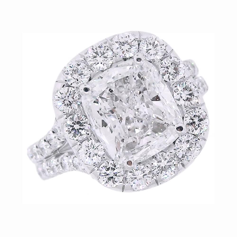 This Platinum ring features a 5.09 Carat Cushion cut Diamond of excellent cut.  F Color, SI2 Clarity.   The ring with 2.26 Carats of micro-pave set Diamonds.  This astounding Diamond looks like 8 Carats!  Beautiful brilliancy and depth of twinkle!