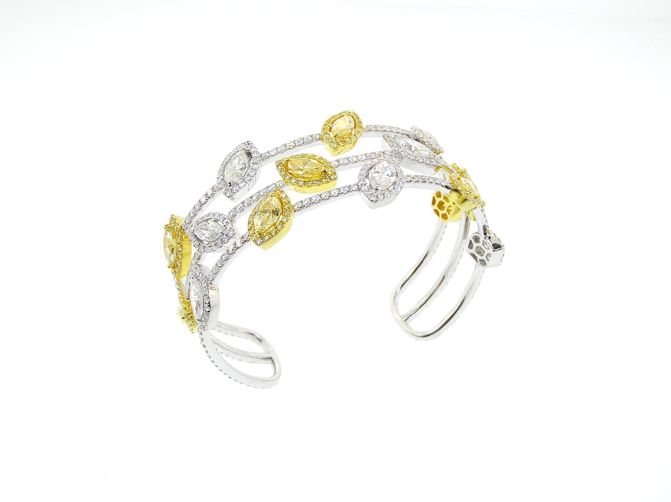 This flexible cuff Bracelet features 13.24 Carats of Natural Canary and White Diamonds.  Very Rare to find Marquise cut Canary Diamonds, as well as matching ones!  G.I.A. Certified.