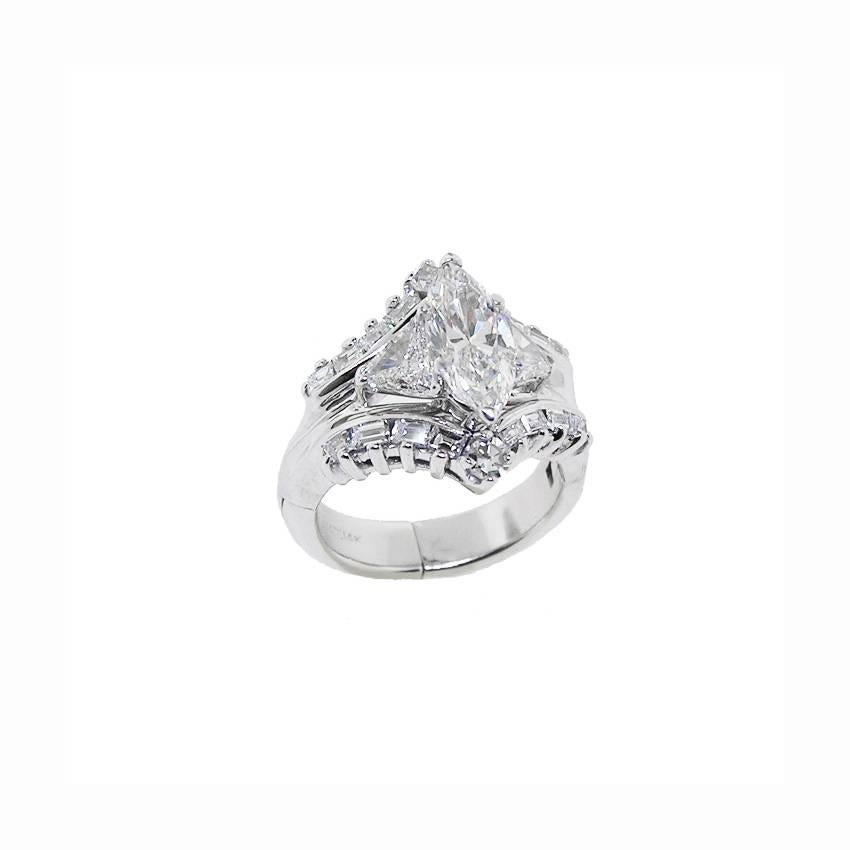 14k White Gold Marquise Diamond Ring.  The 1.19 Carat Marquise cut Diamond  is of superb cut, I Color,  VS2 Clarity.  GIA Certified.  The Trilliant cut, round, square cut and emerald cut Diamonds of good quality.  Total Weight in Diamonds is