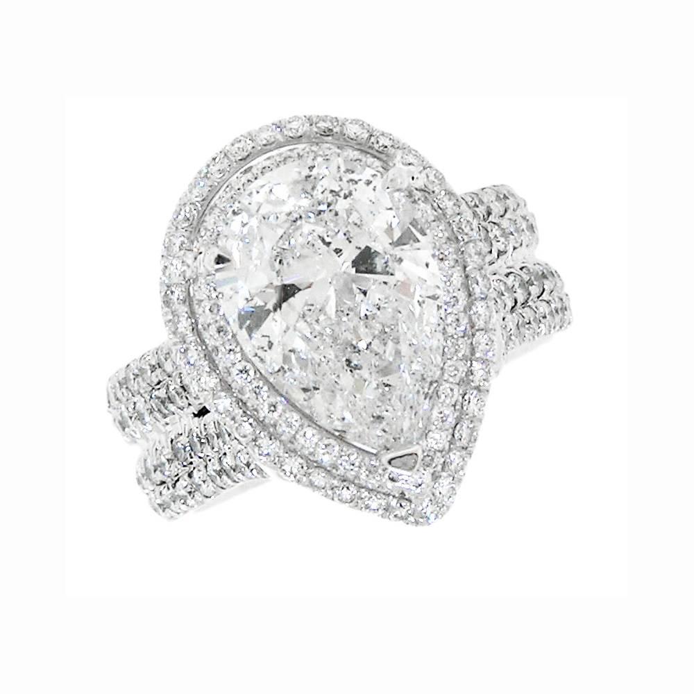 This wonderful Ring has a 5.02 Carat Pear Shape Brilliant cut Diamond of E Color, SI3 Clarity (EGL Certification).  The double shank ring has 225 bead set Modern Round Brilliant cut Diamond of G Color, VS1 Clarity.  Total Weight in Diamonds is 8