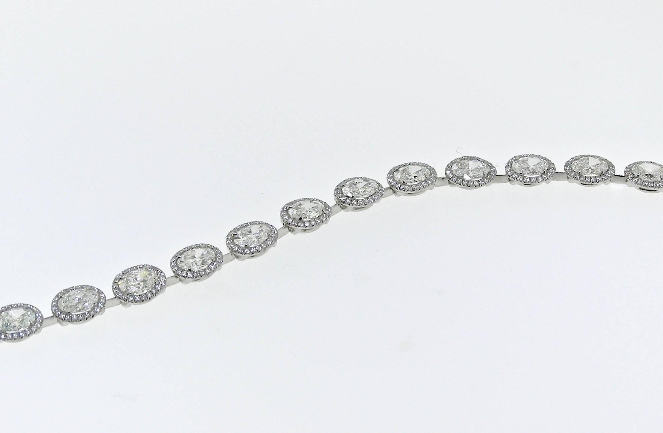 This exquisite piece in Platinum has 17 approximately .50 Carats each Oval cut Diamonds with round Diamond accents.  10 Carats total. Diamonds are of G Color, VS Clarity. Each link is fully articulated, and the piece lays beautifully on the