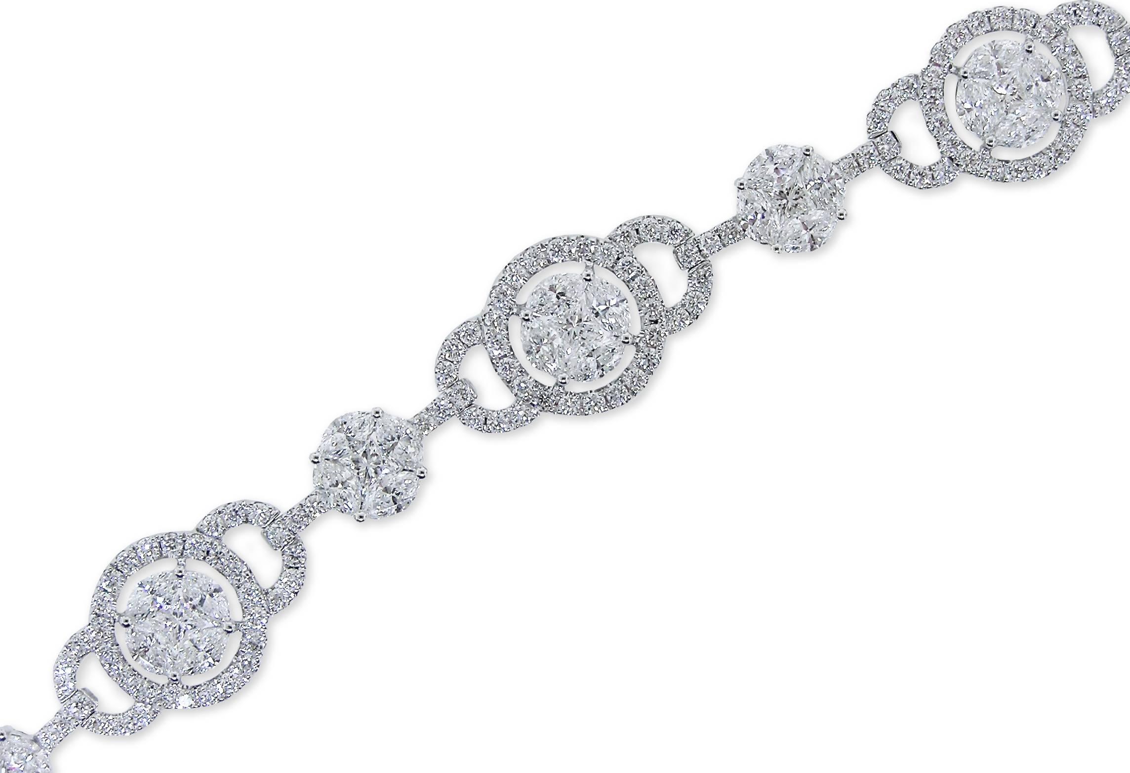The Deco inspired piece of 18K White Gold with nearly 7 Carats of Princess, Marquise and Round Diamonds of high quality.  Wonderfully articulated so it wears so ever deliciously on the wrist.