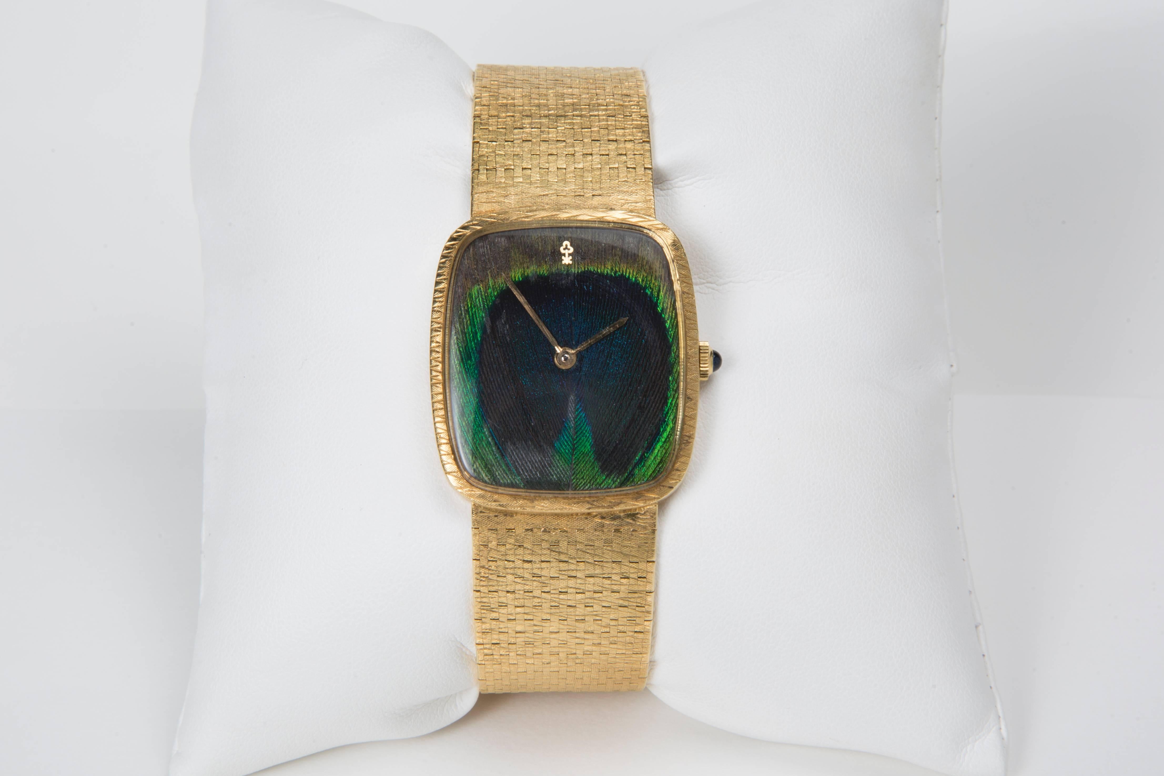 Corum Wristwatch
18K Yellow Gold and Peacock Feather Dial
Circa 1960