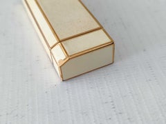 Briquet Cartier vintage en métal blanc et doré