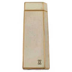 Briquet Cartier vintage en métal blanc et doré
