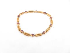 Bracciale Van Cleef & Arpels Vintage con rubini, in oro rosa 18 carati, con maglie testurizzate