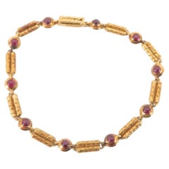 Bracciale Van Cleef & Arpels Vintage con rubini, in oro rosa 18 carati, con maglie testurizzate
