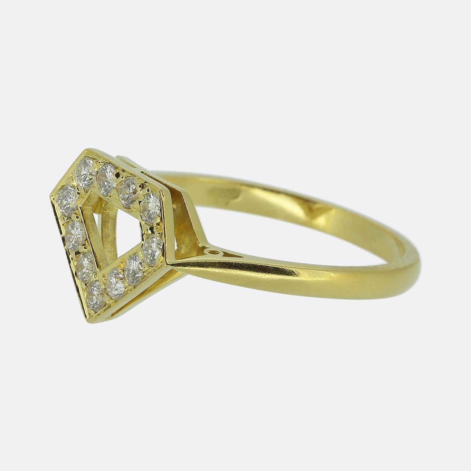 Here we have a wonderful diamond cluster ring from Garrard & Co. Ltd. This piece features a unique geometric design with bright white round brilliant-cut diamonds set in an openwork pattern, forming a striking hexagonal shape at the face of the