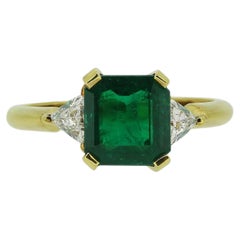 1.80 Carat Emerald and Diamond Three-Stone Ring