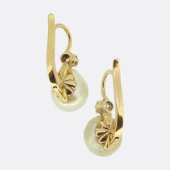 Boucles d'oreilles pendantes en perles naturelles et diamants