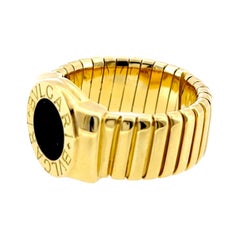 Bague Tubogas Bvlgari en or jaune 18 carats et onyx, taille ajustable 7,5, Italie