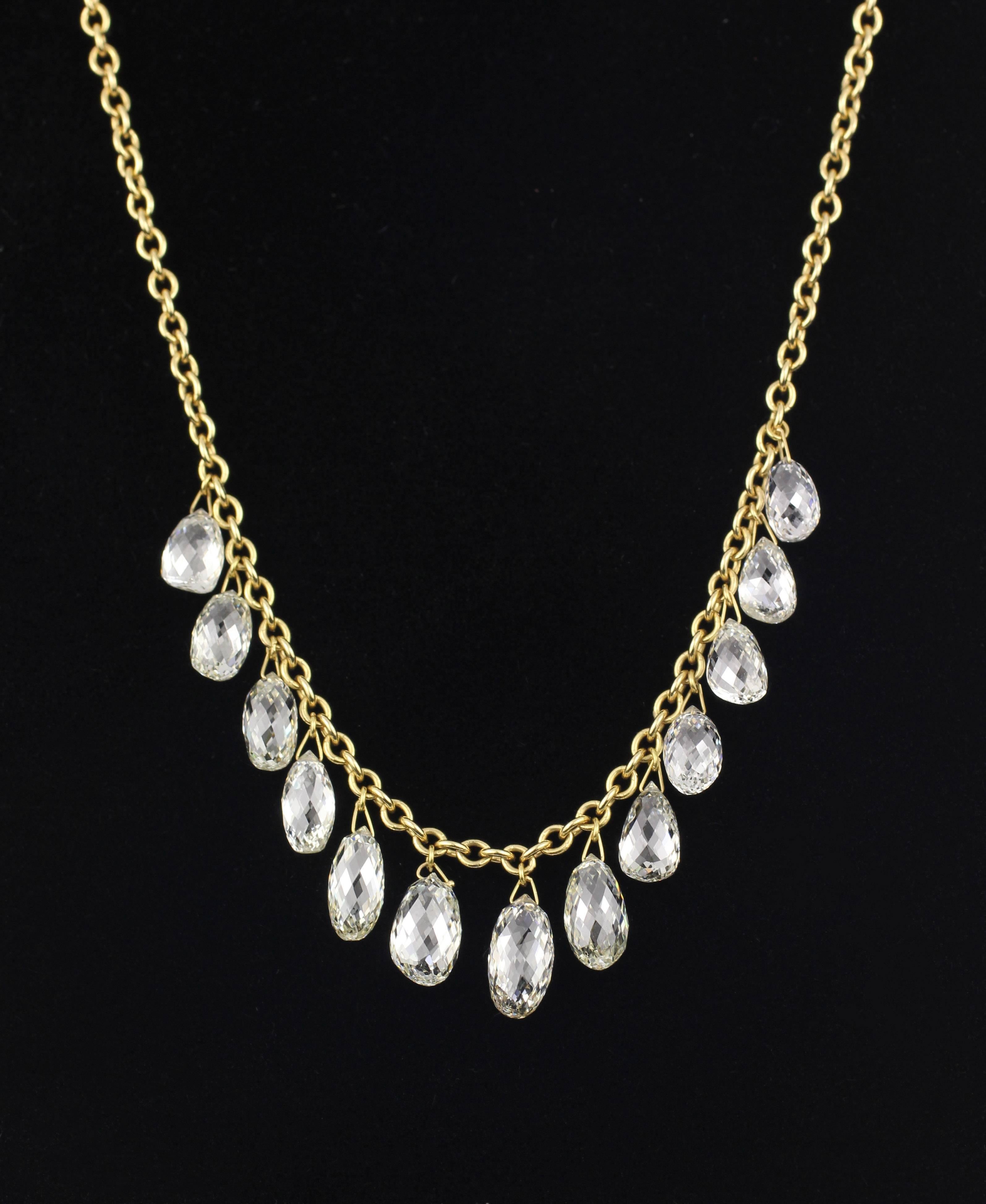This beautiful and unique 18KT Gold and briolette Diamond Necklace contains 12 briolette diamonds equalling 14.26 Cts. Attached to an 18KT gold link chain that measures 18 1/4 inches in length.

Designed and made in house by Julius Cohen New York.
