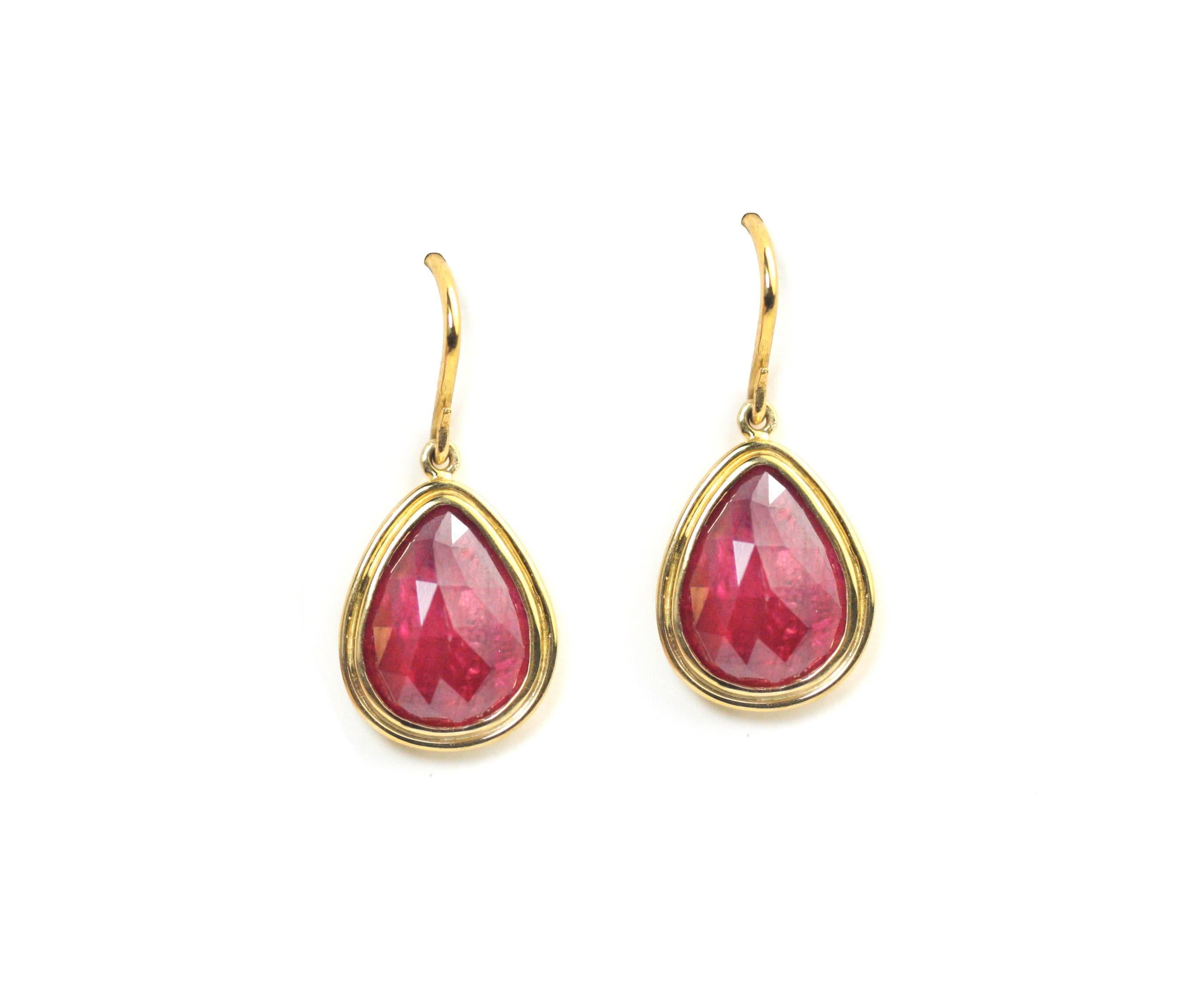 These beautiful earrings are made with 22KT and 18KT gold and contain 2 rose cut Rubies weighing approximately 2 carats.

Designed and made in-house by Julius Cohen New York.