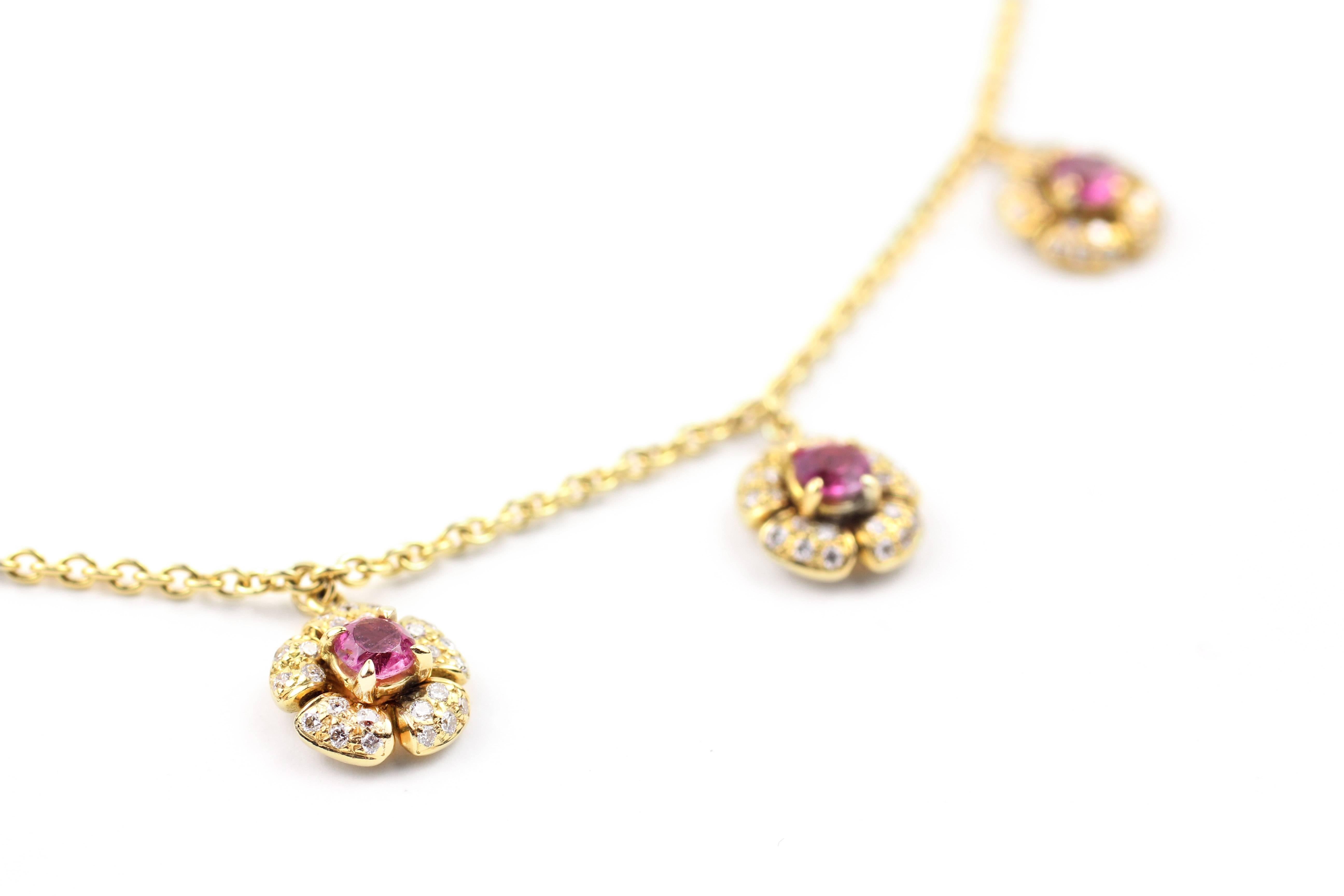 This necklace is made with a 16 inch 18kt gold chain and five 18kt gold flowers containing pink tourmalines (.71cts) and brilliant diamonds at .51 cts.

Designed and made in-house by Julius Cohen New York.