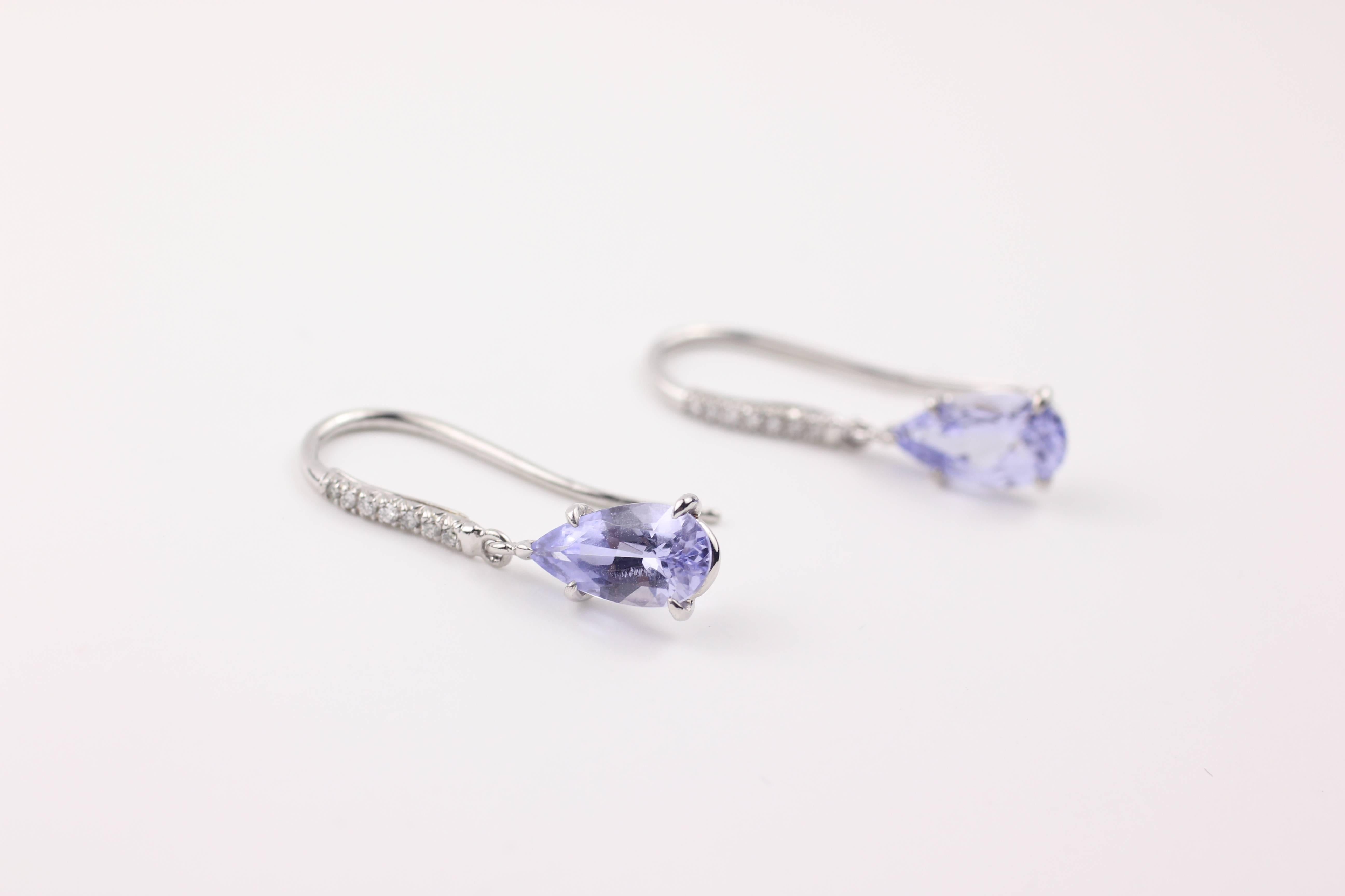 The lavender spinels on these earrings are beautiful and rare.  The two pear-shaped spinels have a combined carat weight of 1.84 cts. and are in 18Kt white gold drop settings.  The earring tops are made of platinum and set with 14 brilliant cut