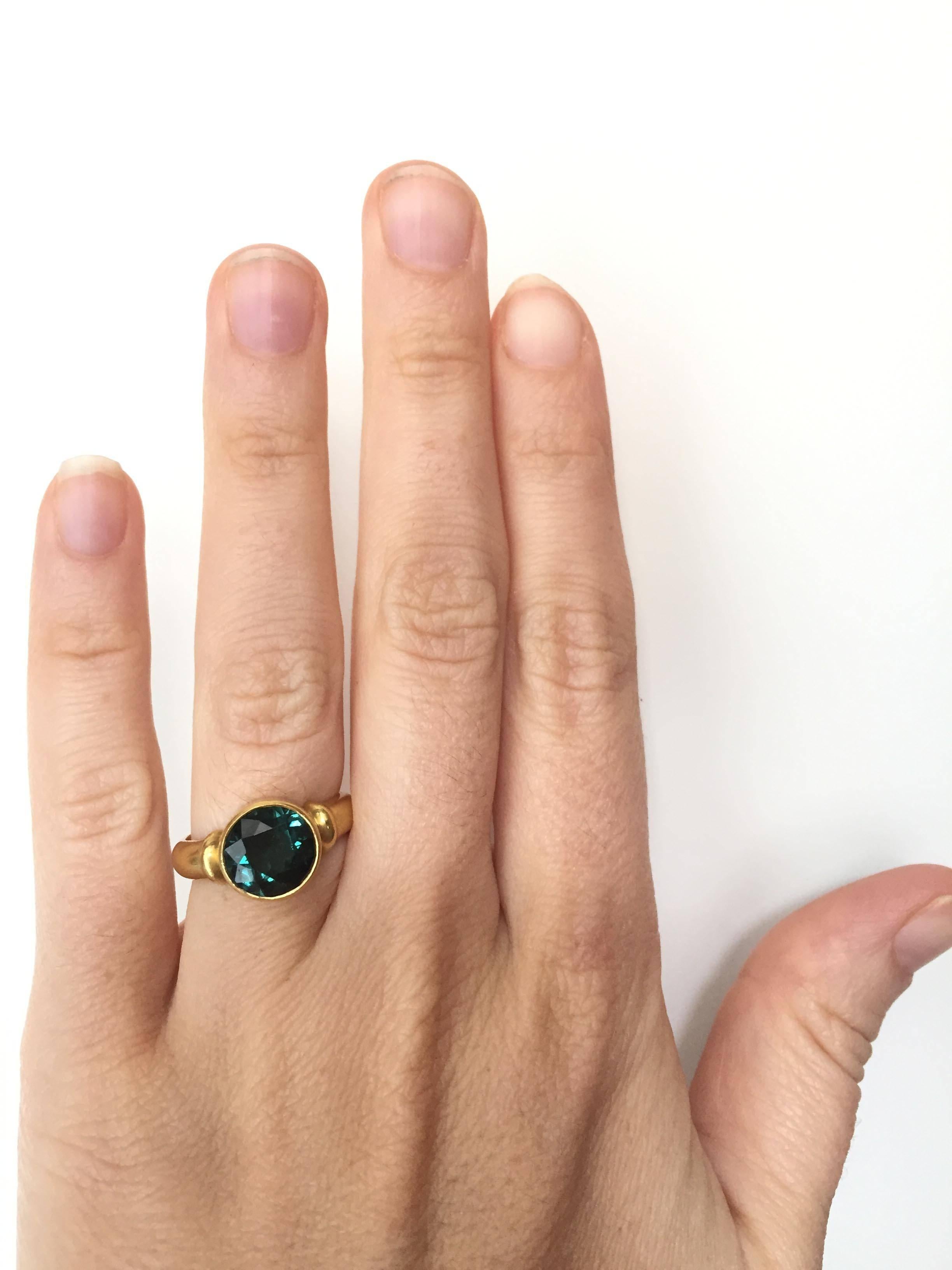 Lovely forest green tourmaline stone (2.60 Cts.) in a lustrous 22 Kt Gold setting.  

Designed and made in house by Julius Cohen New York.

