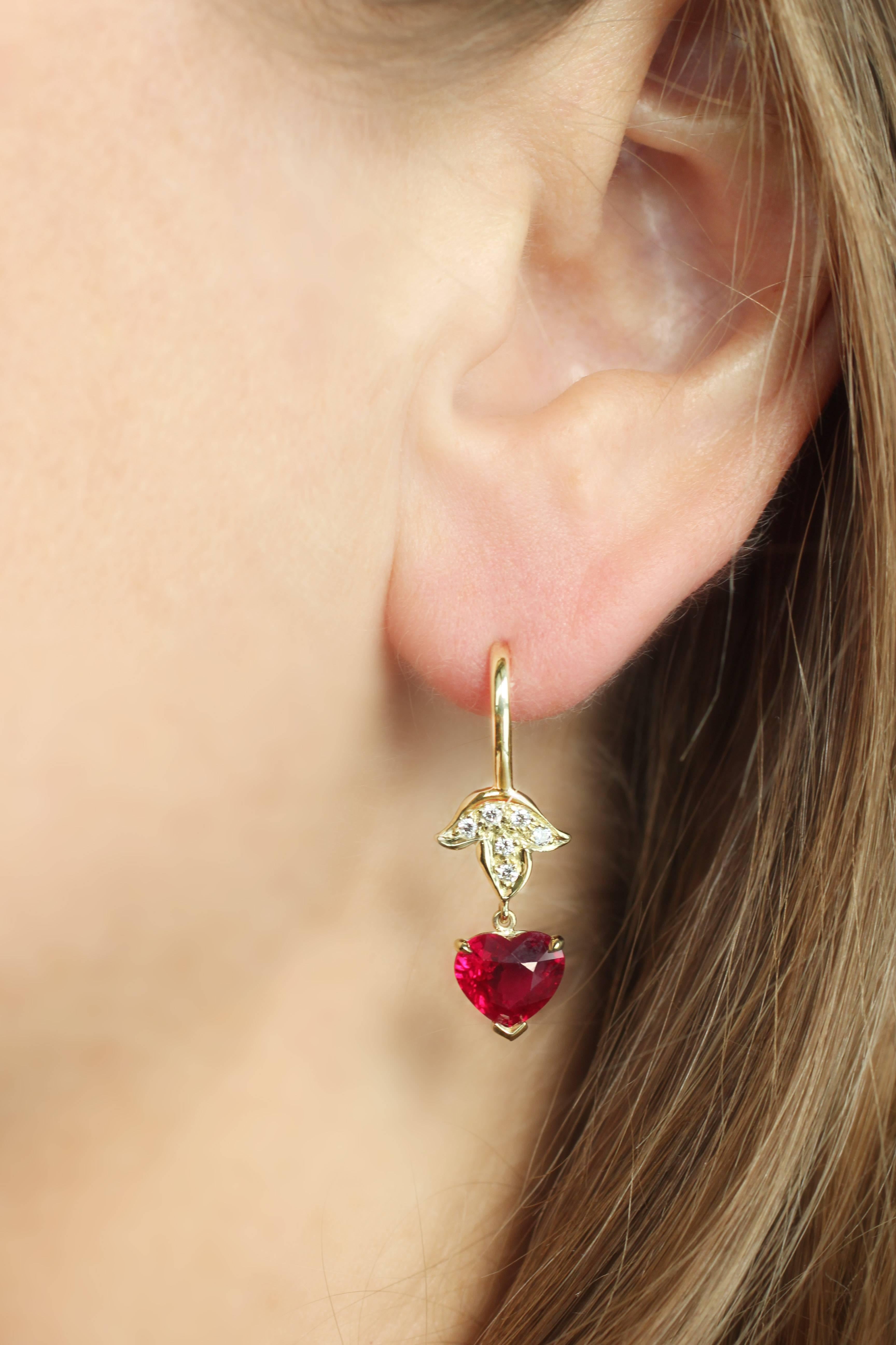 Julius Cohen classic 18 Kt Gold hanging style Leaf Earrings with White Diamond pave leaf motif tops (12 brilliant White Diamonds for the pair).  These beautiful earrings contain two Heart Shape Burmese Ruby Drops (3.97 Cts. for the pair). GIA