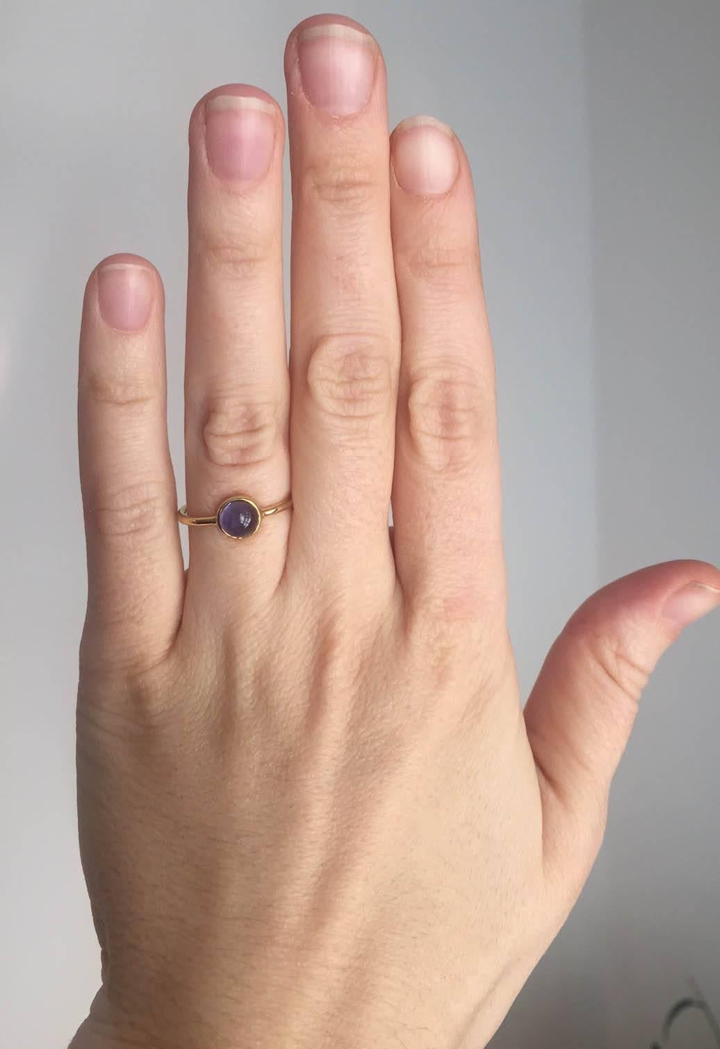 Sweet and minimal 18Kt Gold and Cabochon cut Iolite Ring.

Designed and made in house by Julius Cohen New York.
