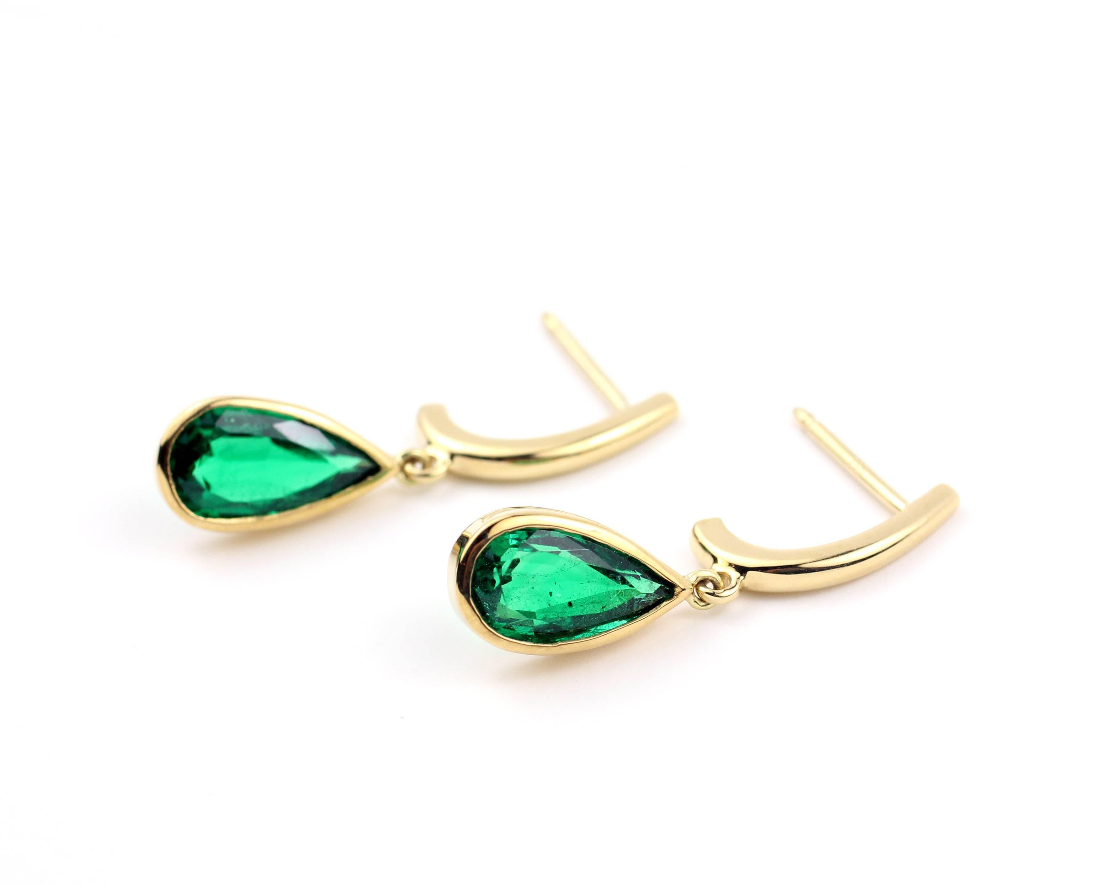 18KT Gold and Pear Shape Emerald Drop Earrings.

These beautiful and vibrant earrings are made with 18KT Gold and contain very fine Pear Shape Emerald Drops equalling 2.31 Cts. 

Designed and made in-house by Julius Cohen New York.