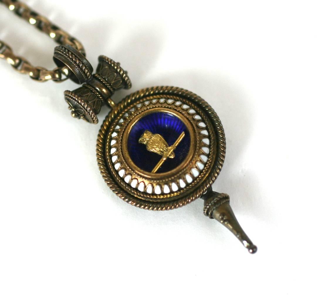 Charming Victorian Revivalist Owl Necklace from the late 19th Century. Charming owl motif which signified knowledge and wisdom, rendered as a beautifully detailed gold bird on branch within a blue enameled cup, bordered with white enamel and