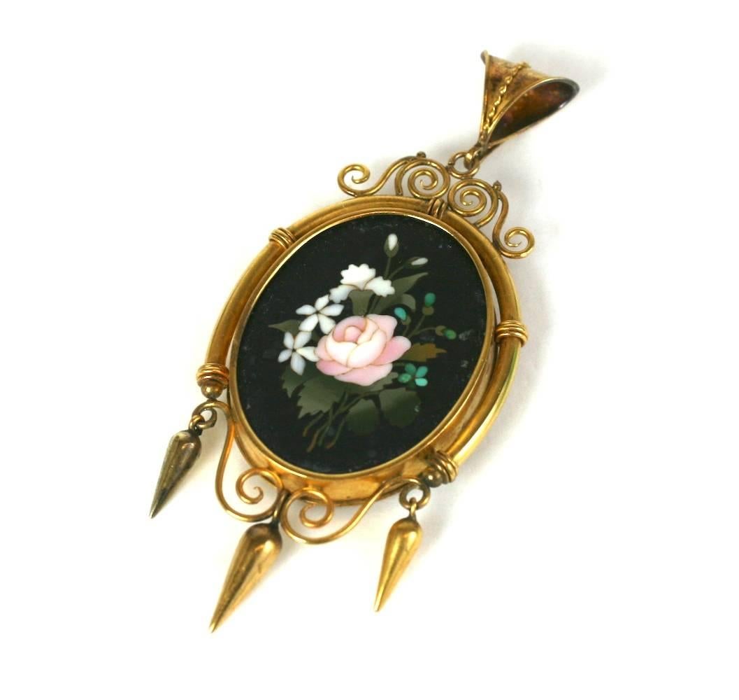 Large Victorian Pietra Dura Locket Pendant from the mid 19th Century set in 18K gold with higher karat gold bloom. 
Lovely scrolled frame mounting with Etruscan bale with twisted wire decoration. Removeable glass panel on back for photo. 
Wonderful