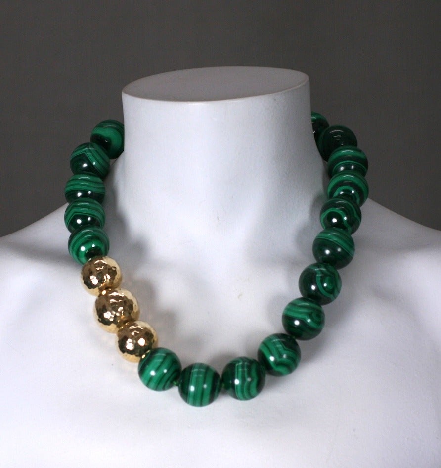 Oversized hand knotted Malachite beads are accented with 3 large hammered 14k gold beads. Attractive and wearable classic. Beads 20mm. Length 20