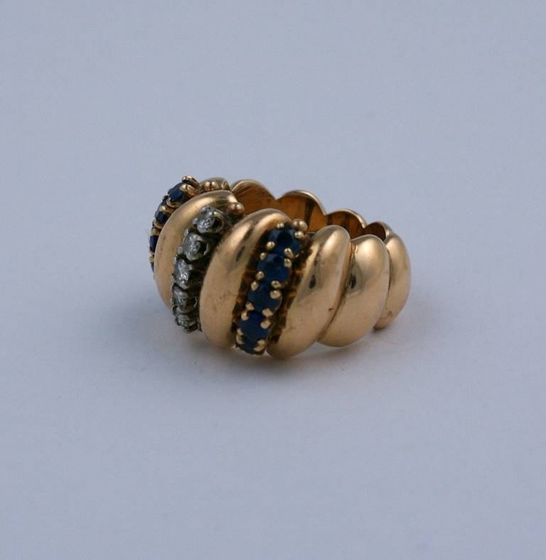 French Retro Diamond and Sapphire Swirl Cocktail Ring. 18k yellow gold with prong set diamonds and sapphires inserted within the swirling motifs. 
High style Retro Jewelry.   Marked: From France 18kts 6055
Size 6 US. Width .5
