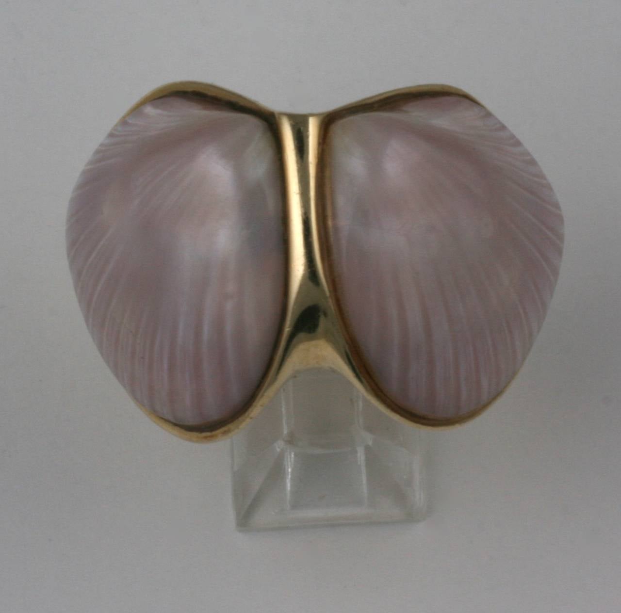 Elegant and formidable oversized ring by Marguerite Stix circa 1965, named The Margaretacea, one of her most recognized and popular designs.
Exotic clam shells with a pinky lilac iridescence are the "stones" used for this ring. An