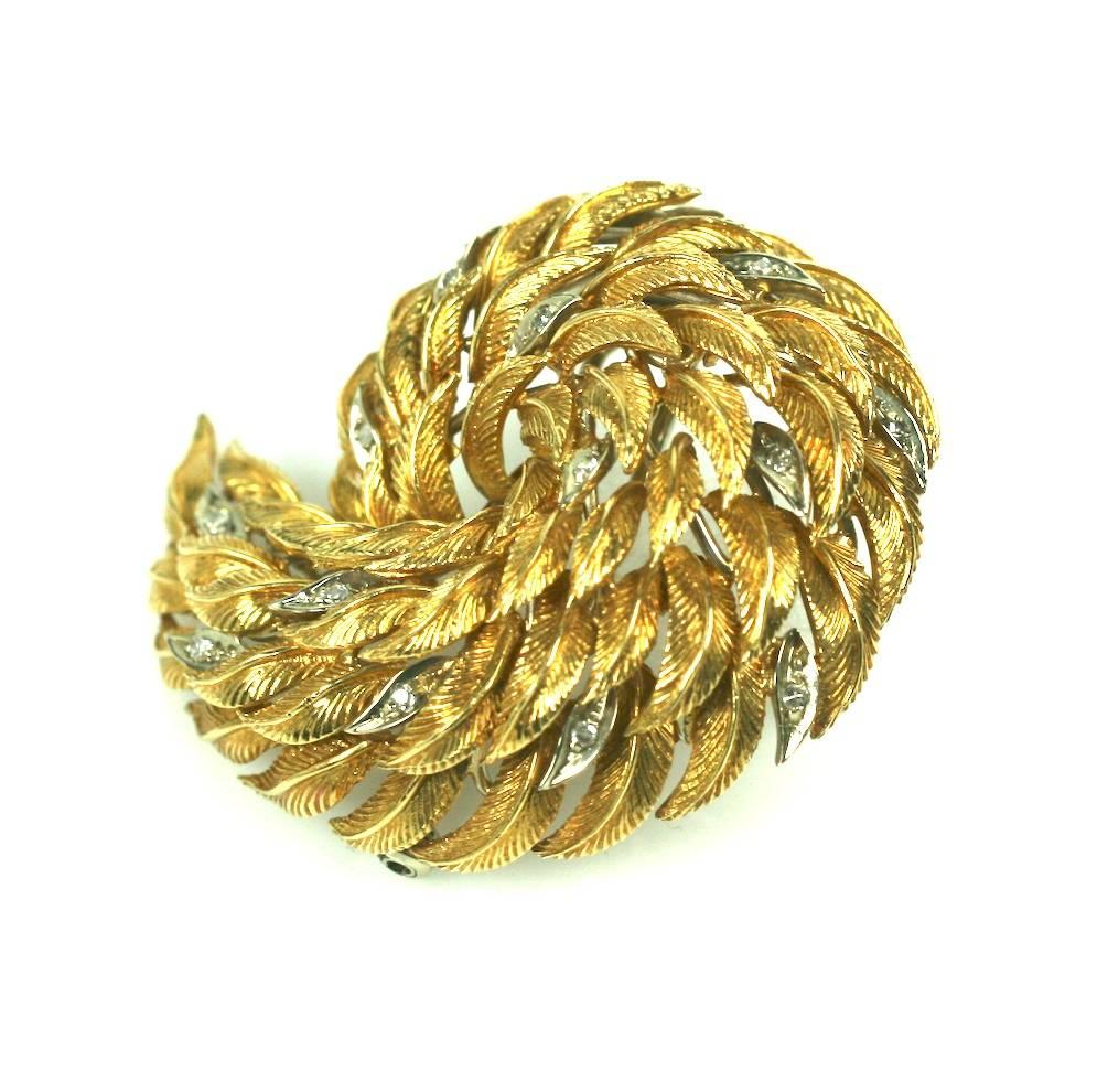 Elegant Gold Swirled Leaf clip of 18K gold textured leaves, some accented with tiny diamonds (14 in total) set in contrasting white gold. Weighty and dimensional swirl clip-brooch with a refined and tailored look. 1960's USA. Excellent condition. 2