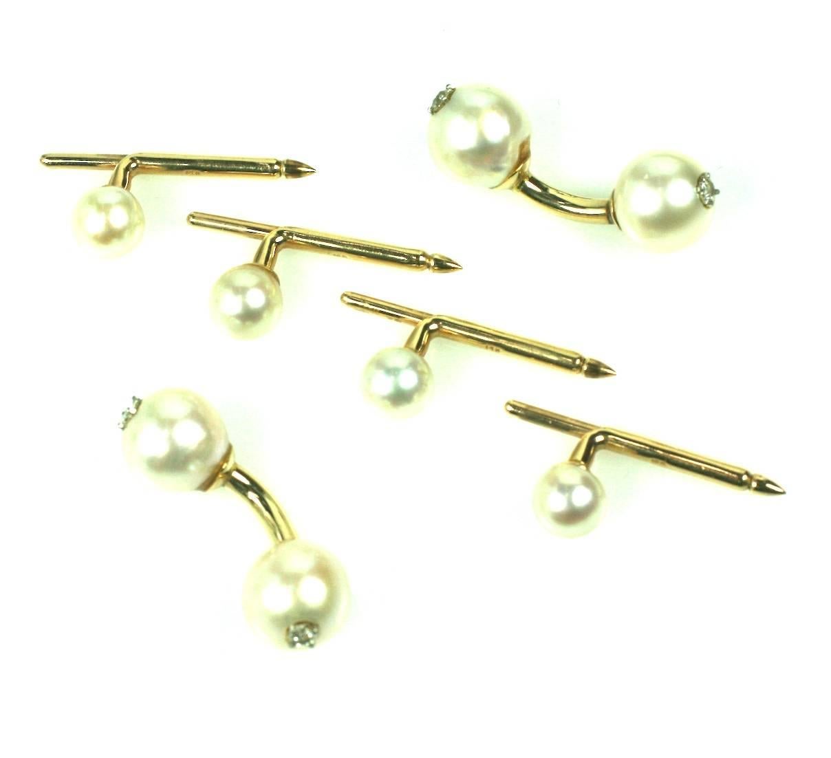 Pearl And Diamond Stud Set set in 14k gold. Barbell style pearl links (10 mm) with diamond centers match the 4 pearl shirt studs (6mm). Elegant and timeless mens formal wear. USA 1950's. Excellent condition.