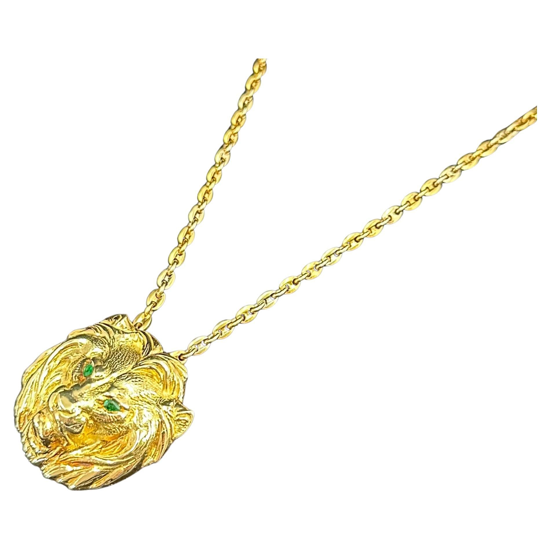 Cartier Paris, large Lion medallion with Green Emerald Eyes.
The Leo medallion is hallmarked Cartier and numbered
 18 karat Yellow Gold.
The chain is also signed Cartier and numbered.
The chain is 20.5 inches in length
The medallion is 2 inches x