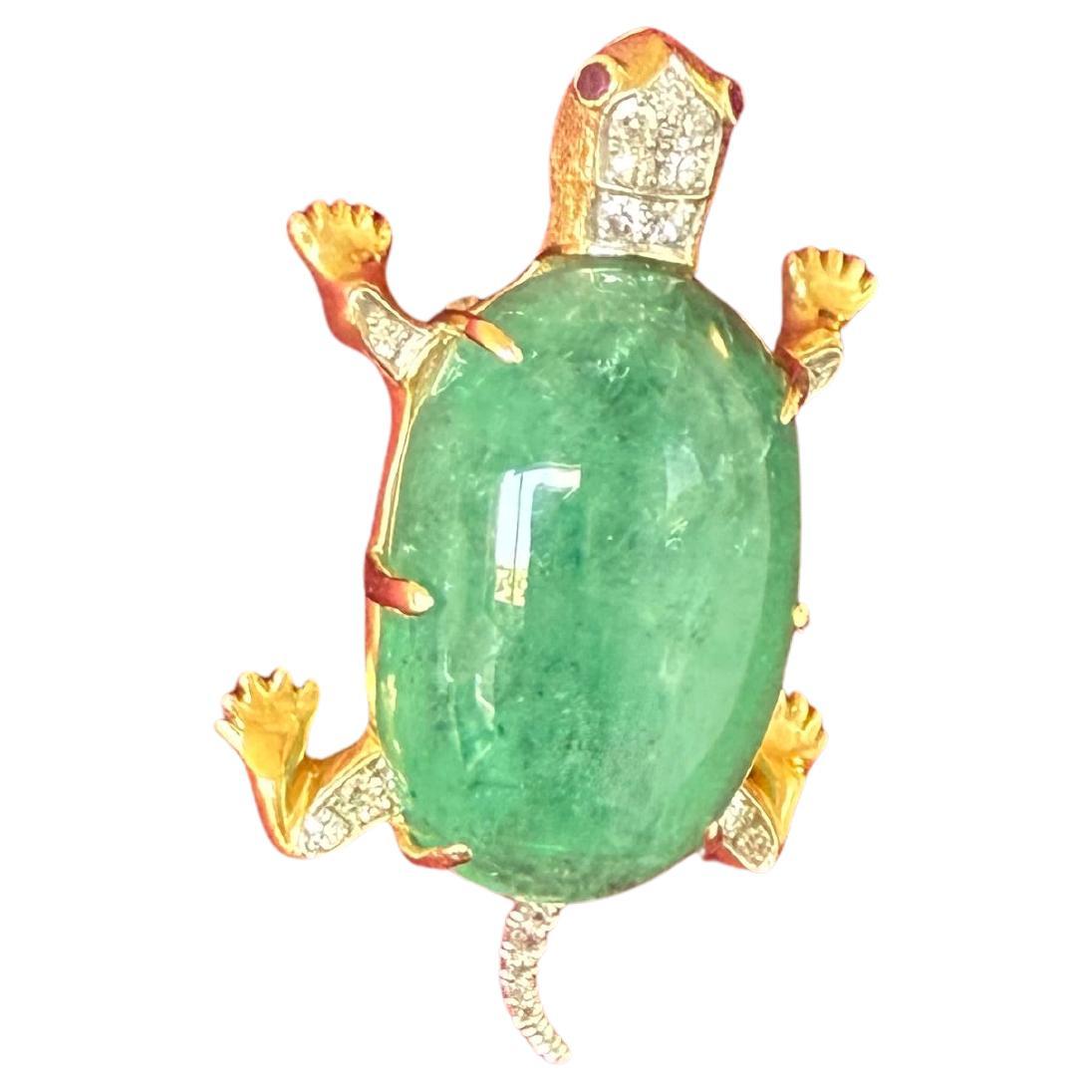 1950's Large 14k Turtle With A Massive 50 ct Cabochon Green Emerald 
Cabochon Emerald 
Dimensions: 30 mm 18mm 13.1 mm     EST 50 CTS
The body of the turtle is set with diamonds on each leg and his tail. The diamonds are set in either white gold or