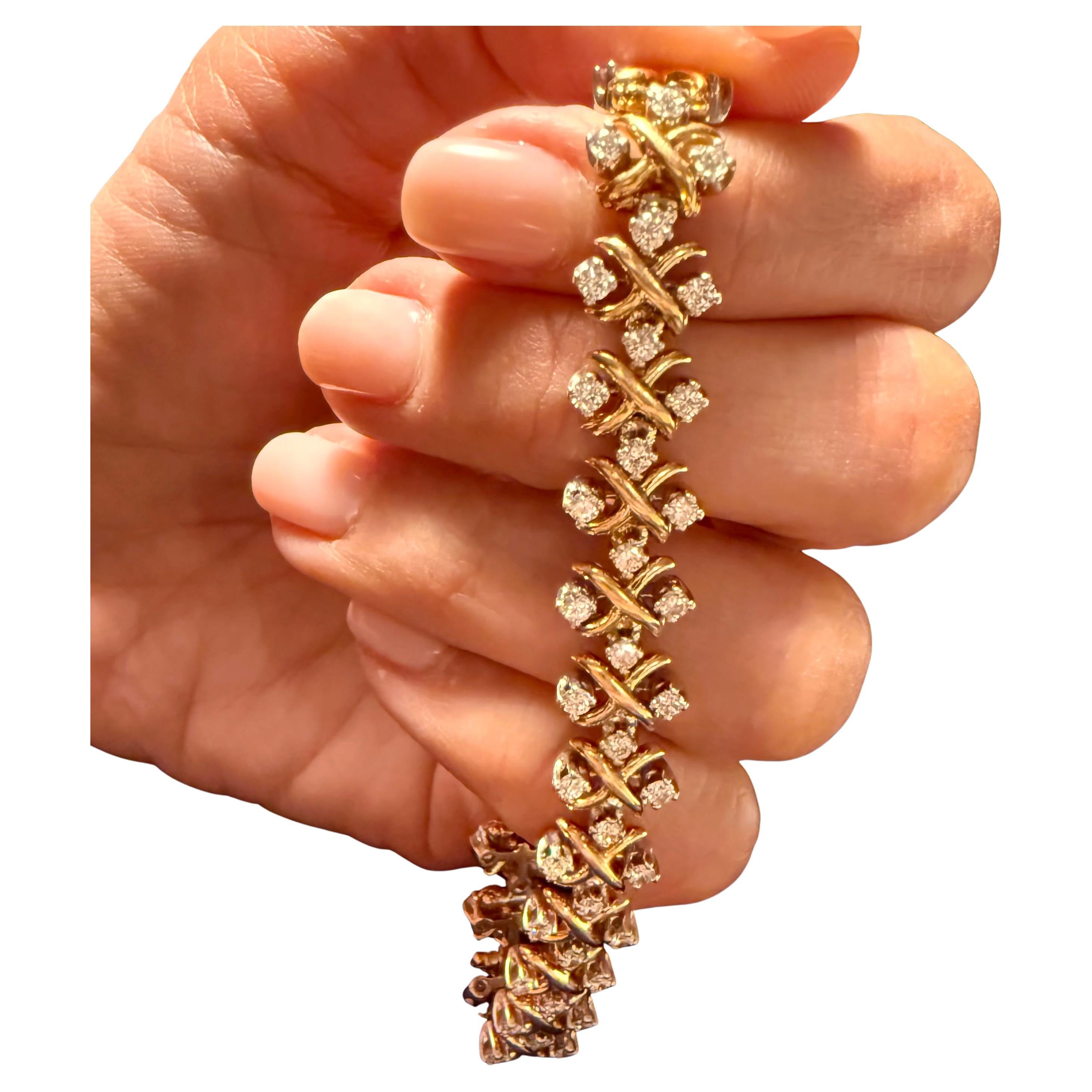 Jean Schlummerger for Tiffany & Co 3.80 cts Round Diamond Link Bracelet . 18k karat yellow gold and platinum X motif links with four diamonds on each link there are total of 76 diamonds all high quality F VVS quality. The length of the brace is 7.25