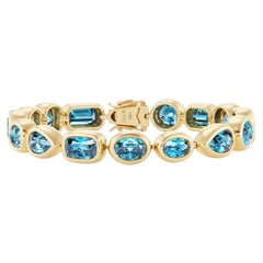Pulsera de oro amarillo de 18 quilates y circonitas «Riviera Blue» de Erica Courtney – 43,70 CTW