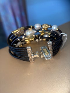 Bracciale Misani a sette fili in oro giallo 18 carati, argento e pelle con perle