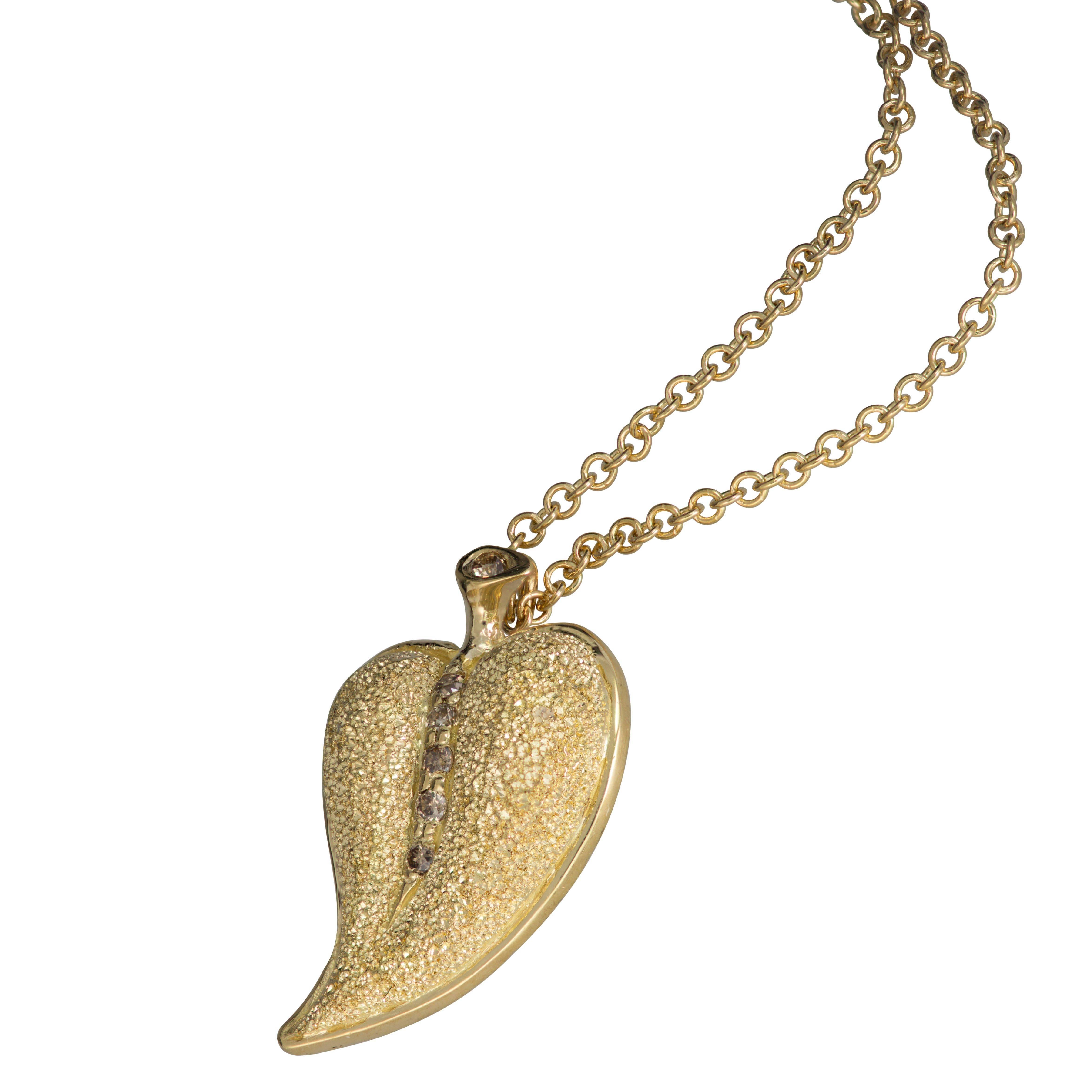 Alex Soldier Leaf pendant is made in 18 karat yellow gold with champagne diamonds (0.05 ct) and signature metalwork that creates an illusion of a diamond inlay. Handmade in NYC. Limited Edition. (includes 18 karat gold chain, 18 inches).   

About