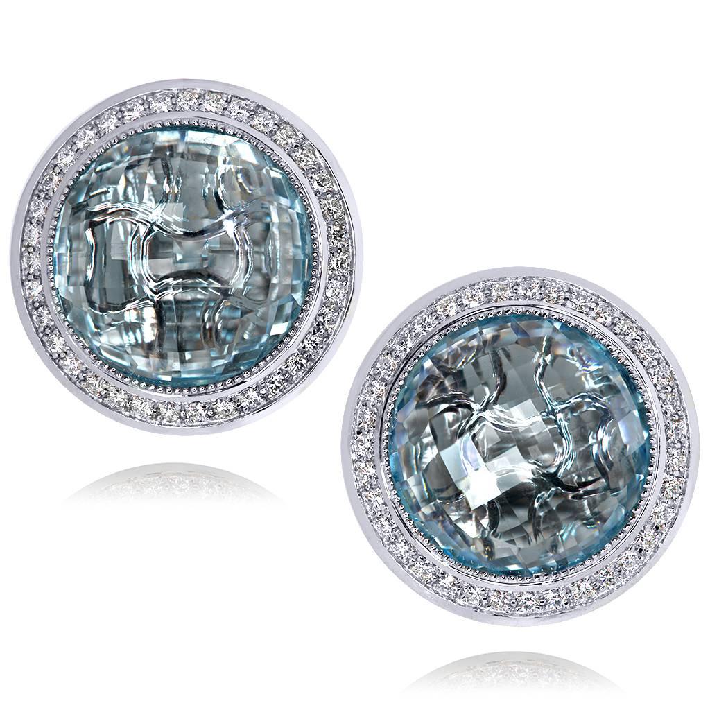 Inspired by the grandeur of antiquity, the Symbolica collection is enriched with meaning. The hand-carved gallery that reveals itself through the dramatic blue topaz center creates an illusion of ancient symbols that in turn form an aura of timeless