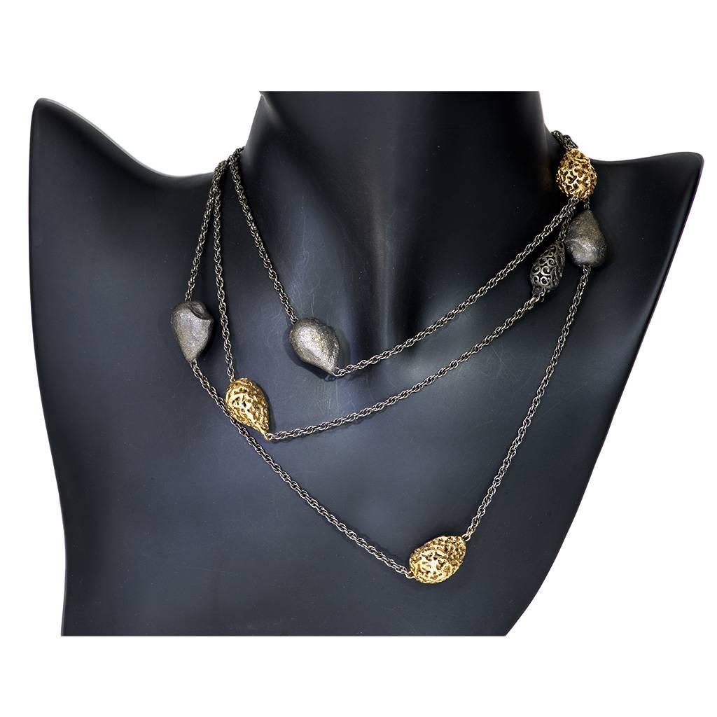 Alex Soldier Meteorite Necklace is made in silver infused (deep plating) with 24 karat yellow gold and dark platinum (rhodium). It features a hidden clasp that opens and allows the necklace to double or triple wrap around the neck for versatile