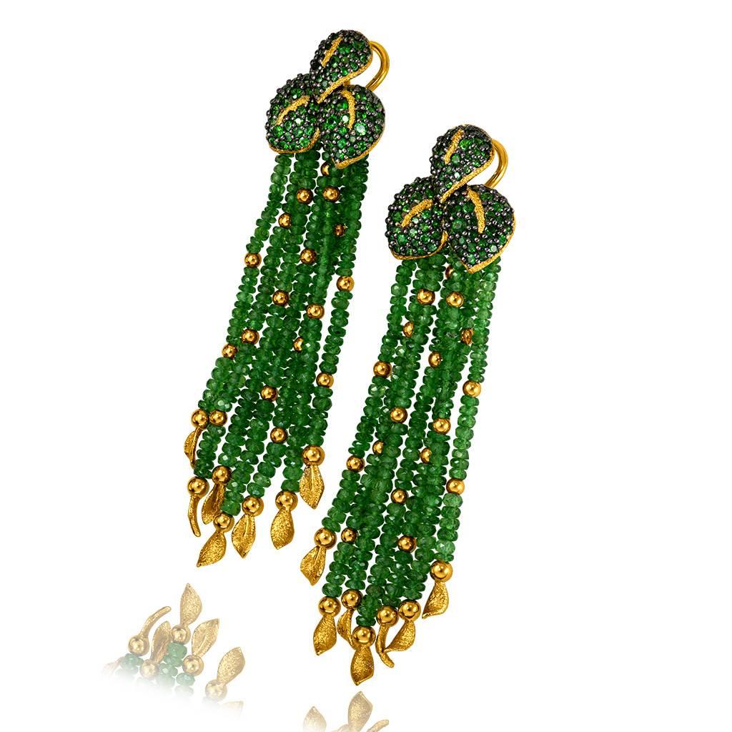 Alex Soldier Green Leaf Earrings are a stunning work of art made in 18 karat yellow gold with 82 carats of tsavorites (green garnets) and 4 carats of Siberian chrome diopside, also known as Siberian emerald. The earrings feature 14 gold leafs, each