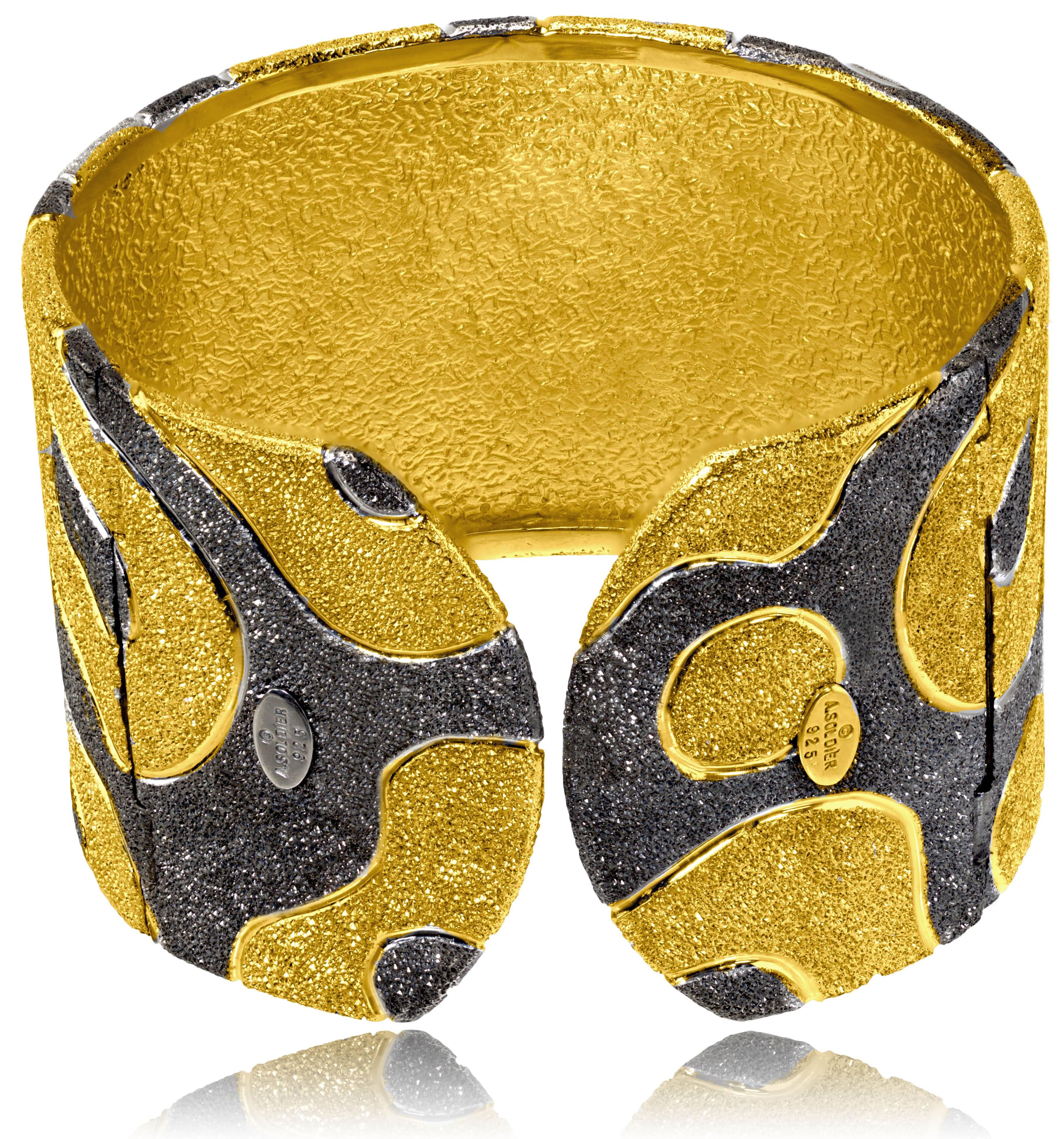Alex Soldier Cora Cuff: made in silver with 24 karat yellow gold and dark platinum  (rhodium) infusion (deep plating). Handmade in NYC, it features double hinges for extra comfort and is finished with proprietary metalwork that creates an illusion
