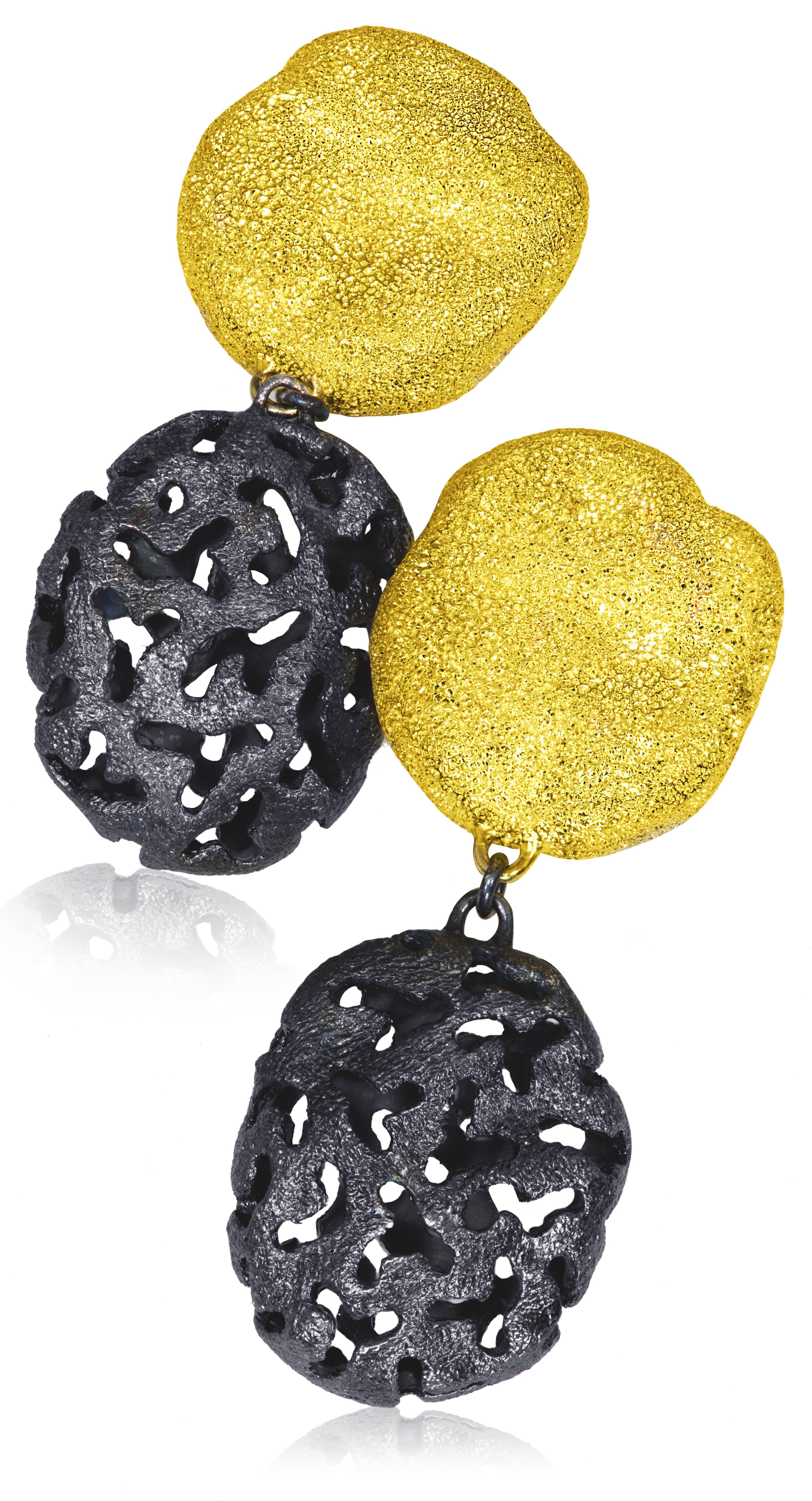 Alex Soldier Moneta Clip Earrings made in silver with 24k yellow gold and dark platinum (rhodium) infusion (deep plating) and signature metalwork that creates an illusion of a diamond inlay. Handmade in NYC. $550.   

Key Facts About The Artist: