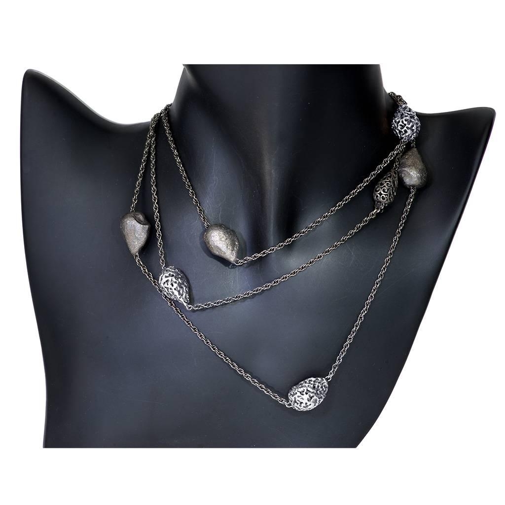 Alex Soldier Meteorite Necklace: made in silver, infused (deeply plated) with platinum, hand textured with signature metalwork that creates an illusion of inner sparkle. The necklace features a hidden clasp that opens and allows it to double or