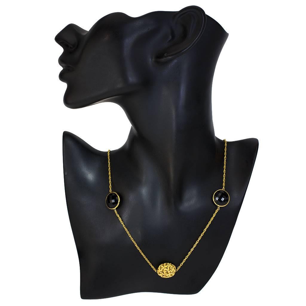 Alex Soldier Moneta Necklace: made in 14 karat yellow gold with black onyx (14 carats) and signature proprietary metalwork that creates an illusion of a diamond inlay. The necklace features a clasp that allows it to be wrapped around the neck into a
