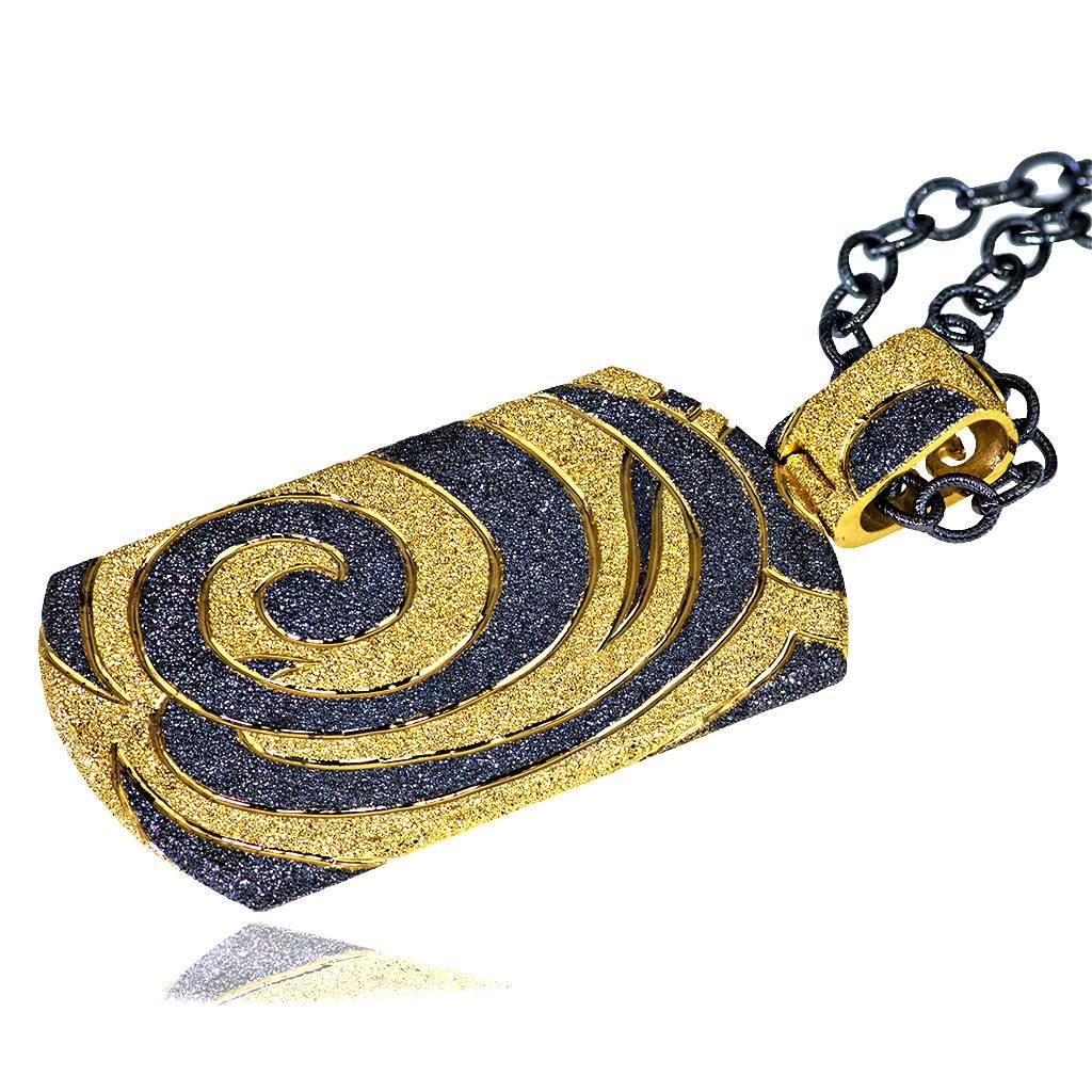 Swirl Tag Pendant Necklace: made in silver with 24k yellow gold and dark platinum infusion (deep plating), suspended on 36 inch dark silver chain with adjustable length size (chain is included in price). Handmade in NYC, it features proprietary