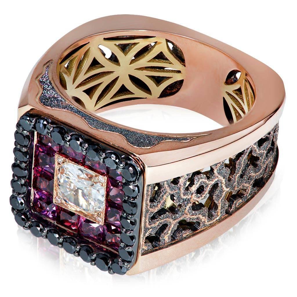 Alex Soldier "Infinite Greatness" Men's Ring in 18 karat rose and yellow gold with diamonds and rhodolite garnets. Center white diamond: 0.75 ct. Small white diamonds: 4 stones, total carat weight: 0.02 ct. Black diamonds: 28 stones, total