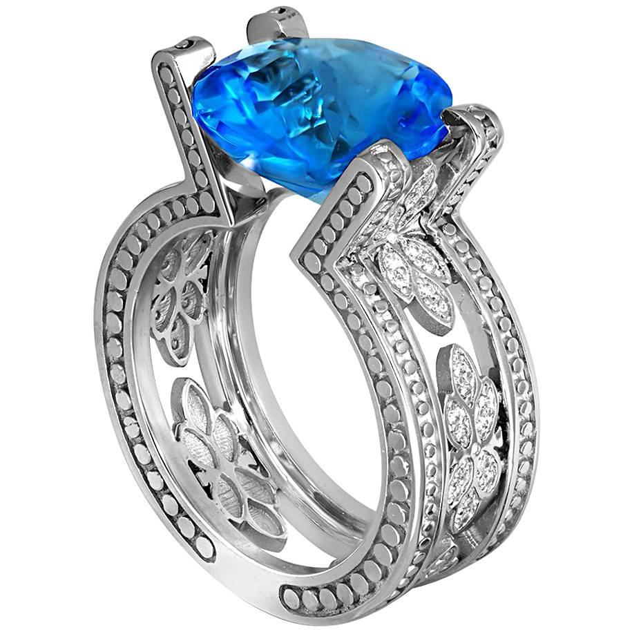 Alex Soldier Teardrop Ring is made in 18 karat white gold with tension-set blue topaz (7 ct.) and white diamonds (0.25 ct.). Handmade in NYC. One of a kind. Ring size: 6.5. Complimentary ring sizing is available within 2 business days.